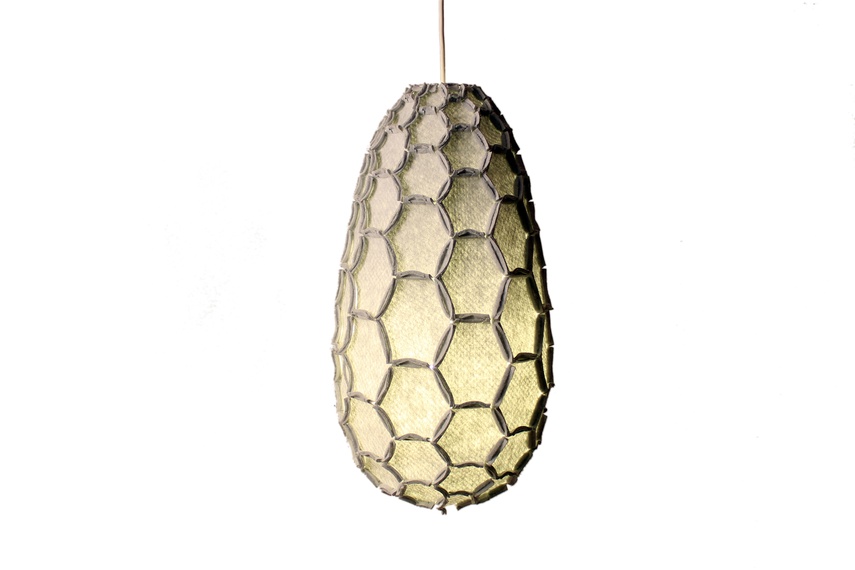 The Nectar lampshade uses the beehive as inspiration to craft lightweight strong shapes from waste material.