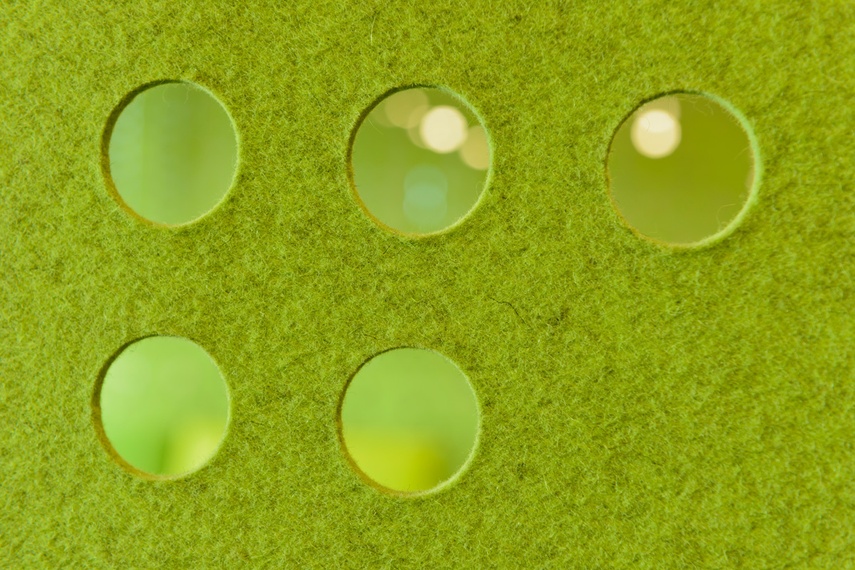Perforated hanging panels in green