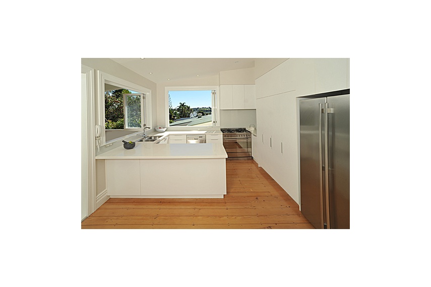 Devonport Kitchen – cabinet fronts melamine, benchtops quantum quartz, splashbacks coloured glass