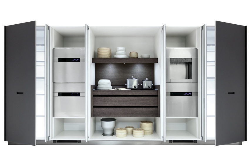 Kyton kitchen with pocket doors that completely fold open to access all appliances.