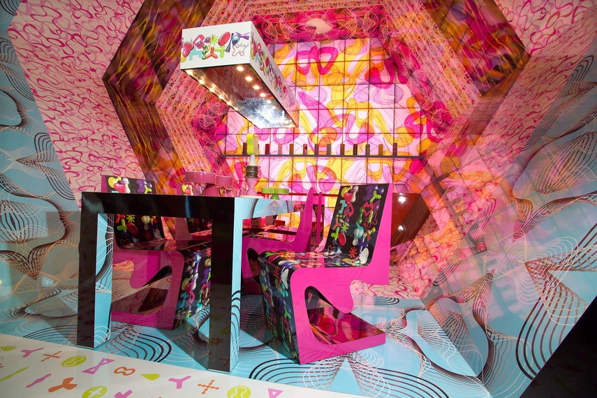 Table and chairs designed by Karim Rashid with Digitalia laminate by Abet Laminati